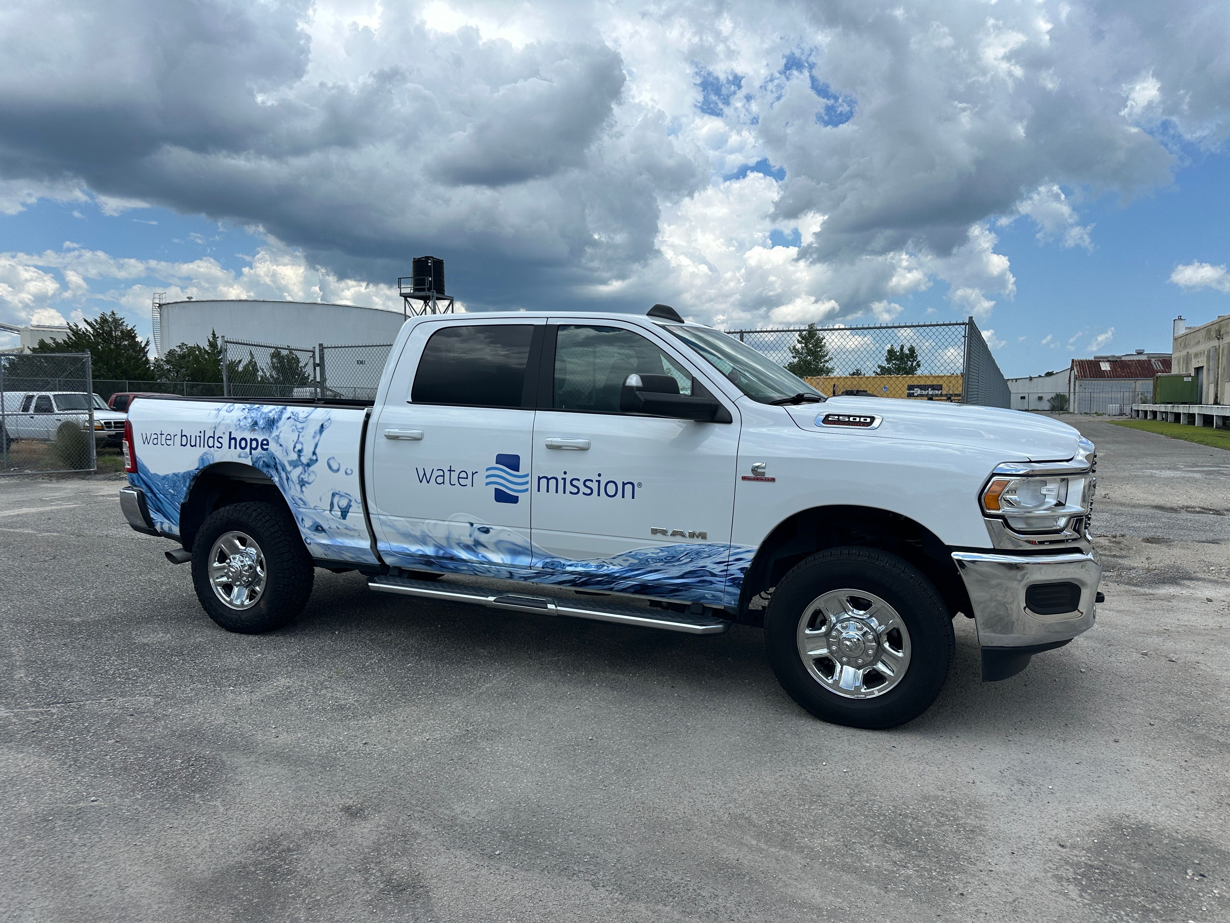 Water Mission wrapped pickup in parking lot