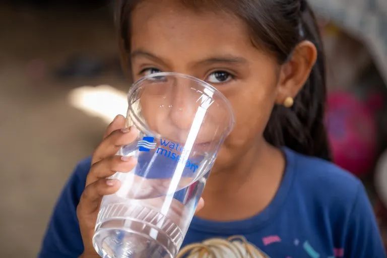 Girl drinking safe, clean water