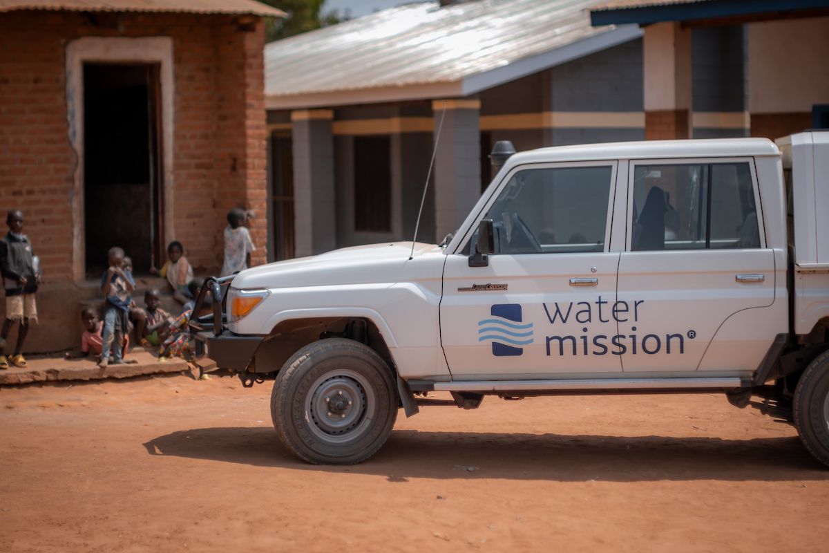Kids in front of Water Mission truck