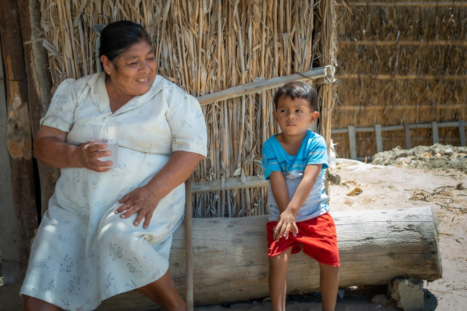 Woman and boy drinking safe, clean water