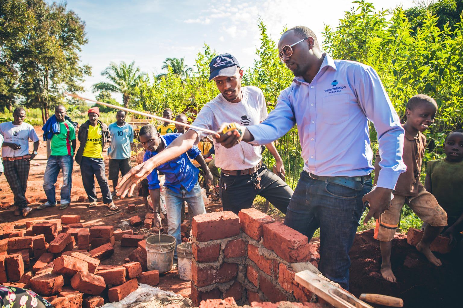 Men stacking bricks
