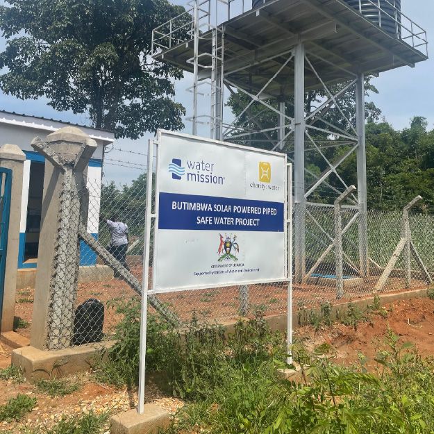 Signage with Water Mission logo in primary position and partner logos in secondary placement