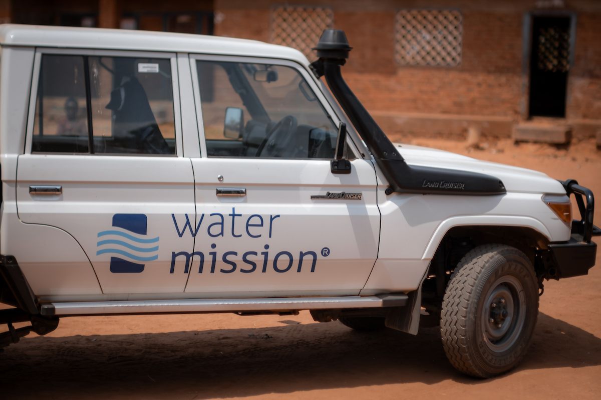 Water Mission logo on white Land Cruiser side view