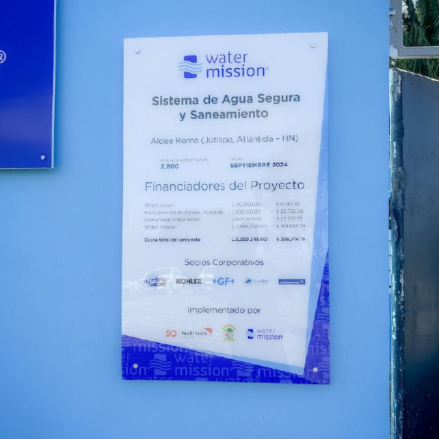 Professional donor recognition plaque with Water Mission logo, white background, and blue accents